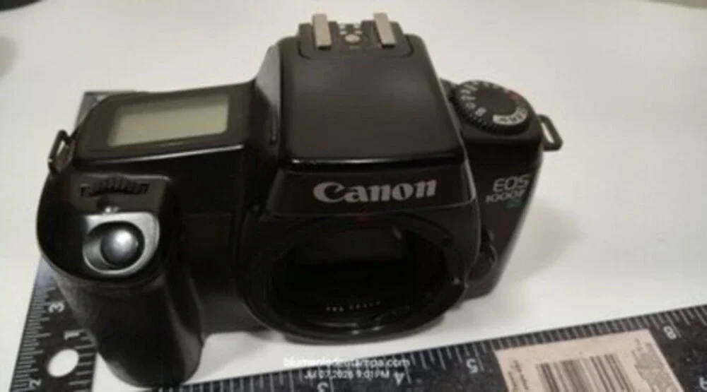 Canon EOS 1000F N 35mm SLR film camera body in black.